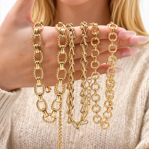 Close-up of diverse gold-plated stainless steel chain necklaces in various link styles