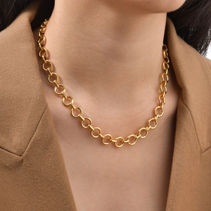 Minimalist thick gold chain link necklace for women worn with a camel blazer