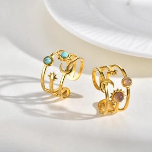 Anello aperto dorato con pietra viola e motivi luna e stella da donna