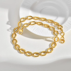 Detailed shot of gold-plated chunky link chain with lobster clasp and extension