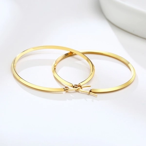 Minimalist wide flat gold hoop earrings with polished stainless steel finish for women