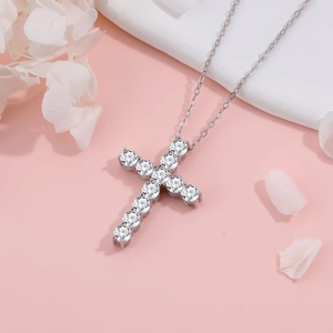 Silver cross necklace with sparkling cubic zirconia stones on a fine link chain