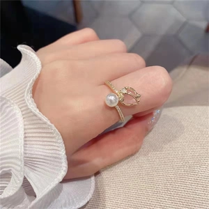 Elegant gold tulip ring with cat eye stone and pearl on hand for women fashion