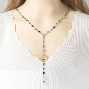 Silver Y-shape long necklace with colorful round crystals shown on a white background