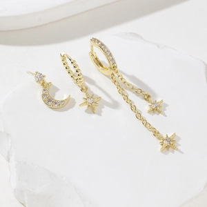 Three-piece gold star and moon asymmetrical earring set with clear zircon stones
