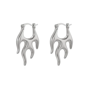 Polished silver flame-shaped hoop earrings with liquid metal aesthetic on white background