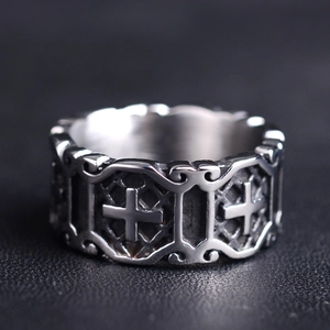 Retro hip hop cross ring with vintage floral patterns on black leather background