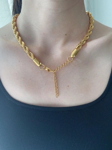 Detail of 8mm gold rope chain necklace showing texture, lobster clasp and extension