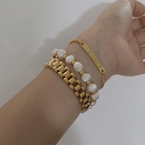 Three-piece gold chain bracelet set with freshwater pearls and rectangular nameplate charm