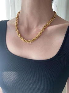 Close-up of 8mm thick 18K gold-plated stainless steel rope chain necklace on model