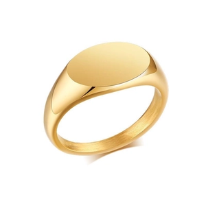 Macro view of polished gold signet ring with a smooth oval flat top and mirror finish