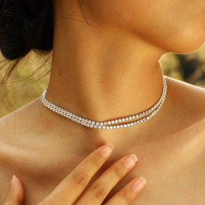 Double-layer silver tennis necklace with 3mm zircons shown on a model in sunlight