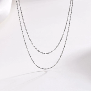 Detail of 1mm silver stainless steel double layered clavicle chain with fine links