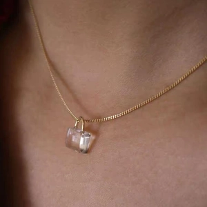 Elegant gold choker necklace featuring a transparent crystal lock pendant for women