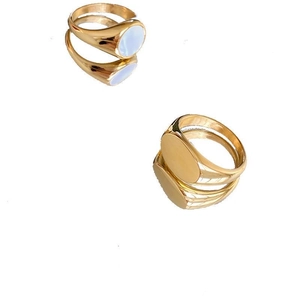 Gold oval signet rings set with blue enamel inlay and polished metallic surface for women