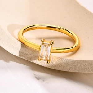 Minimalist gold titanium steel ring with a rectangular emerald cut white zircon stone