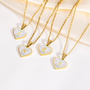 Elegant gold stainless steel necklace featuring a heart-shaped mother of pearl shell pendant