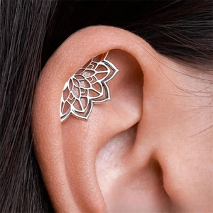Gothic hollow mandala ear cuff in silver metal for helix piercing on model ear