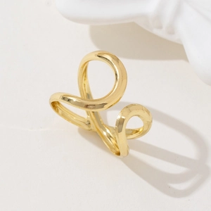 Minimalist gold plated ring with irregular hollow lines and polished abstract design