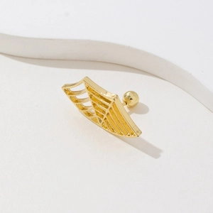 Detail shot of golden punk spiderweb stud earring with secure screw back closure