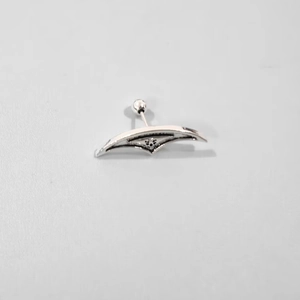 Punk style silver wing stud earrings with dark grooves and polished metallic finish