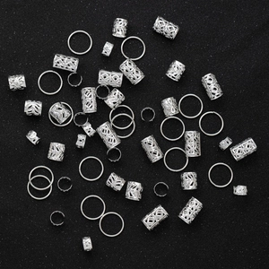 80pcs silver dreadlock jewelry set with hollow hair rings and cuffs on black background