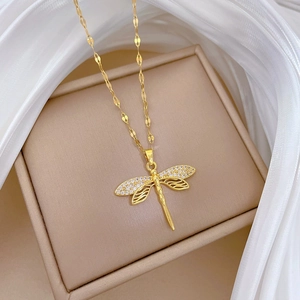 Elegant gold dragonfly necklace with sparkling zircon wings and hollow line design