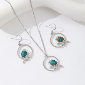 Elegant silver bird on branch necklace and earring set with blue marbled stone inlays