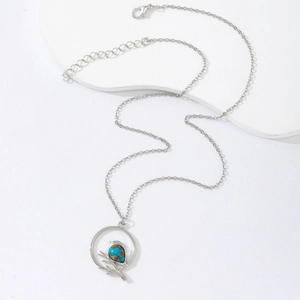 Silver bird on branch round pendant necklace with turquoise stone inlay for women