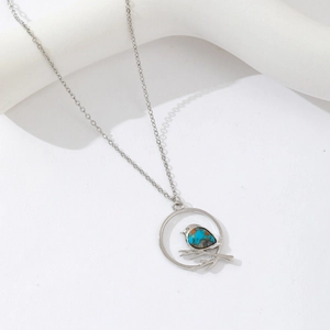 Silver necklace with bird on branch pendant and turquoise stone inlay for women