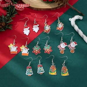 Detailed set of seven Christmas earrings featuring Santa, reindeer, and tree designs