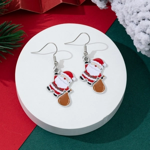 Christmas Santa Claus enamel drop earrings with red and white colors on festive background