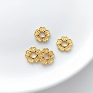 Golden lotus flower spacer beads for DIY jewelry making with matte metallic finish