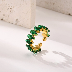 Detail of gold-plated ring featuring marquise-cut green gemstone and adjustable band