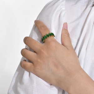 18K gold plated ring with marquise cut green zircon stones on a model hand