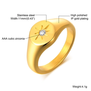 Macro detail of gold stainless steel signet ring with starburst AAA zircon engraving