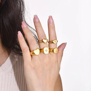 Minimalist gold stainless steel ring set with heart and star zircon designs for women