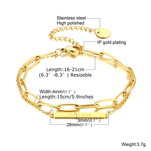 Detail view of double-layer gold stainless steel bracelet with adjustable length and charms