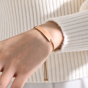 Macro shot of rose gold bar bracelet with adjustable box chain and sliding clasp