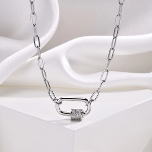Detail of silver paperclip link necklace with oval carabiner pendant and inlaid zircon