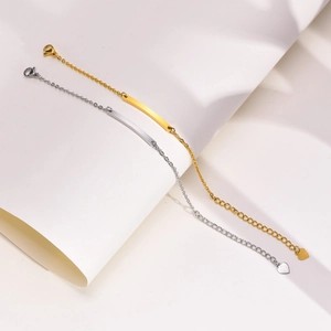Minimalist stainless steel bar bracelet with heart charm in gold and silver finish