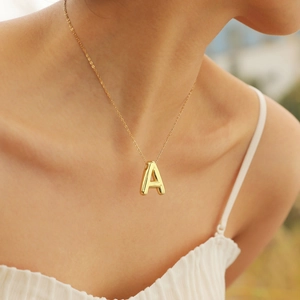 Golden 3D bubble letter A pendant necklace for women with sleek snake chain design