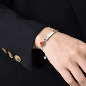 Silver stainless steel chain bracelet featuring a blank engravable bar and strawberry charm