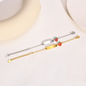 Polished stainless steel ID bracelets in gold and silver with strawberry and heart charms
