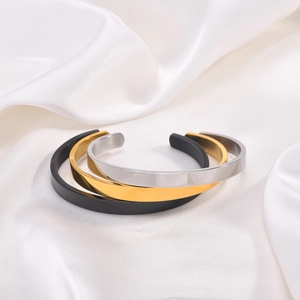 Minimalist C-shaped open cuff bracelets in matte black, mirror gold, and silver stainless steel