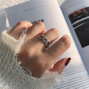 Detailed view of S925 sterling silver chain ring with retro finish on finger