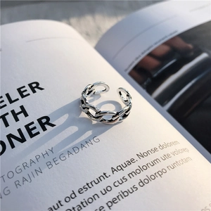 Retro s925 silver wide chain ring with adjustable open design on an open book