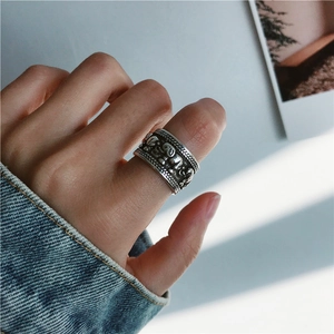 Close-up of wide S925 silver elephant relief ring featuring vintage Thai handicraft textures