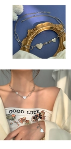 Détail de l'ensemble collier et bracelet en argent S925 avec pendentifs cœur polis