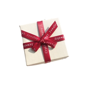 Mini square cream jewelry box with cross-tied red ribbon and Crystal Jewelry print